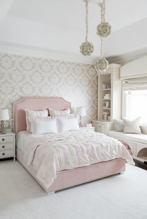 Lovely bed area with soothing wallpaper design