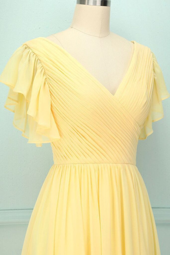 A beautiful butter yellow dress on a cream color dummy for casual day outing.