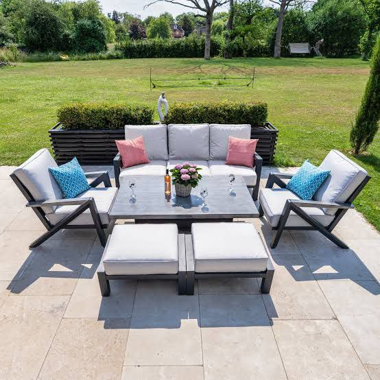 Sleek black outdoor coffee dining height table with matching chairs, perfect for alfresco dining.