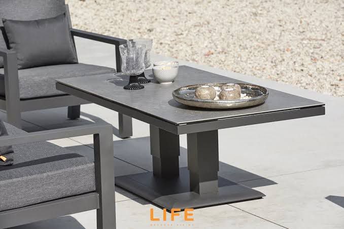 Durable metal terrace coffee height table with a decorative centerpiece, set for an evening gathering.