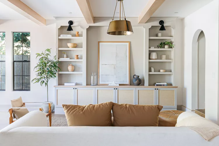 Cozy living room with white built-in cabinet.